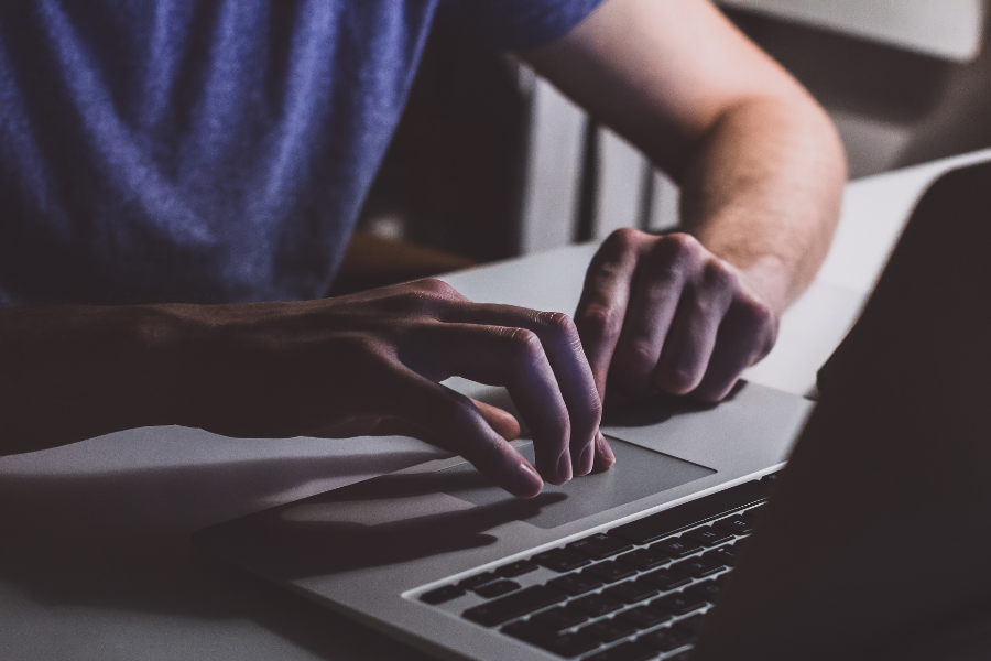 Man using a laptop at a desk