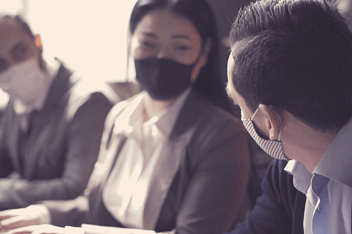 People talking while wearing masks