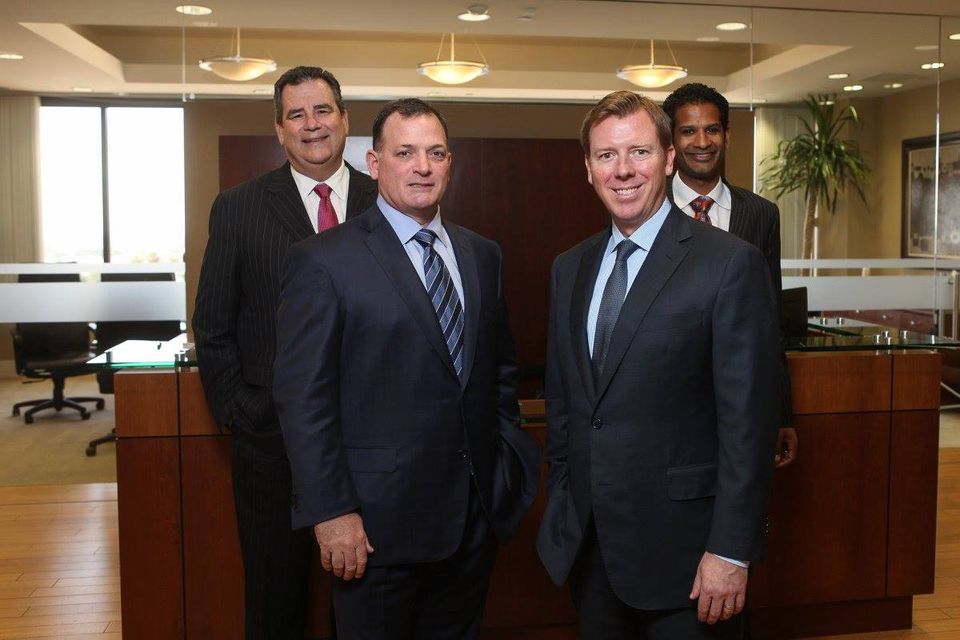 Group shot of Panish, Shea, Boyle and Ravipudi in their office