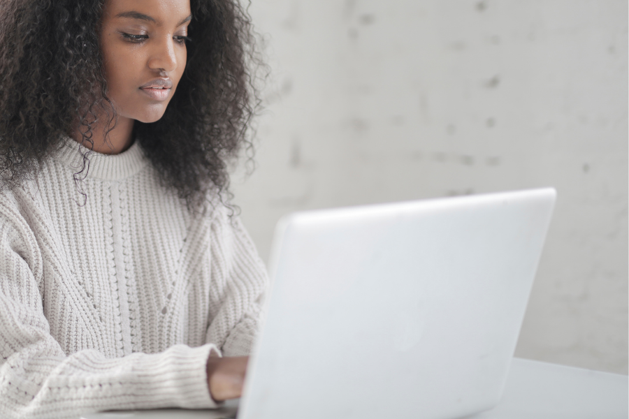 Woman searching online using a laptop