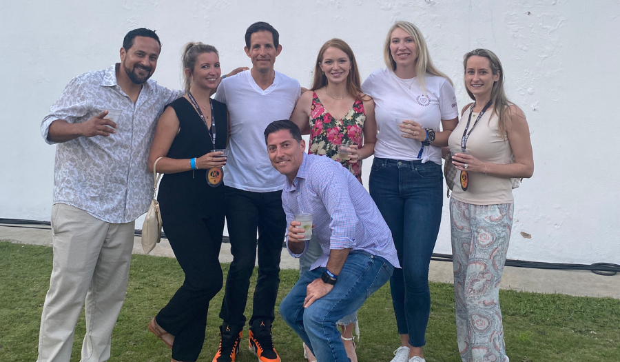 Albert, Maggie, Dylan, Dave, Rachel, Leann, and Carmela standing in a group and smiling 