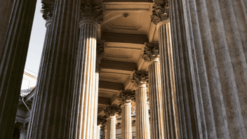 Looking up at courthouse columns