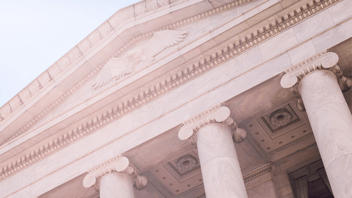 View from outside a courthouse looking up at the columns