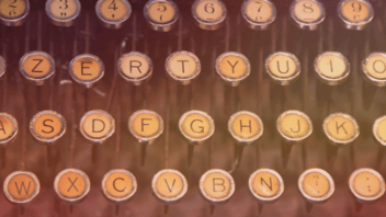 A close-up on buttons found on a stenograph machine.