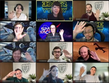 A screenshot of the video squad's morning meeting. The video squad is waving at their cameras and smiling.