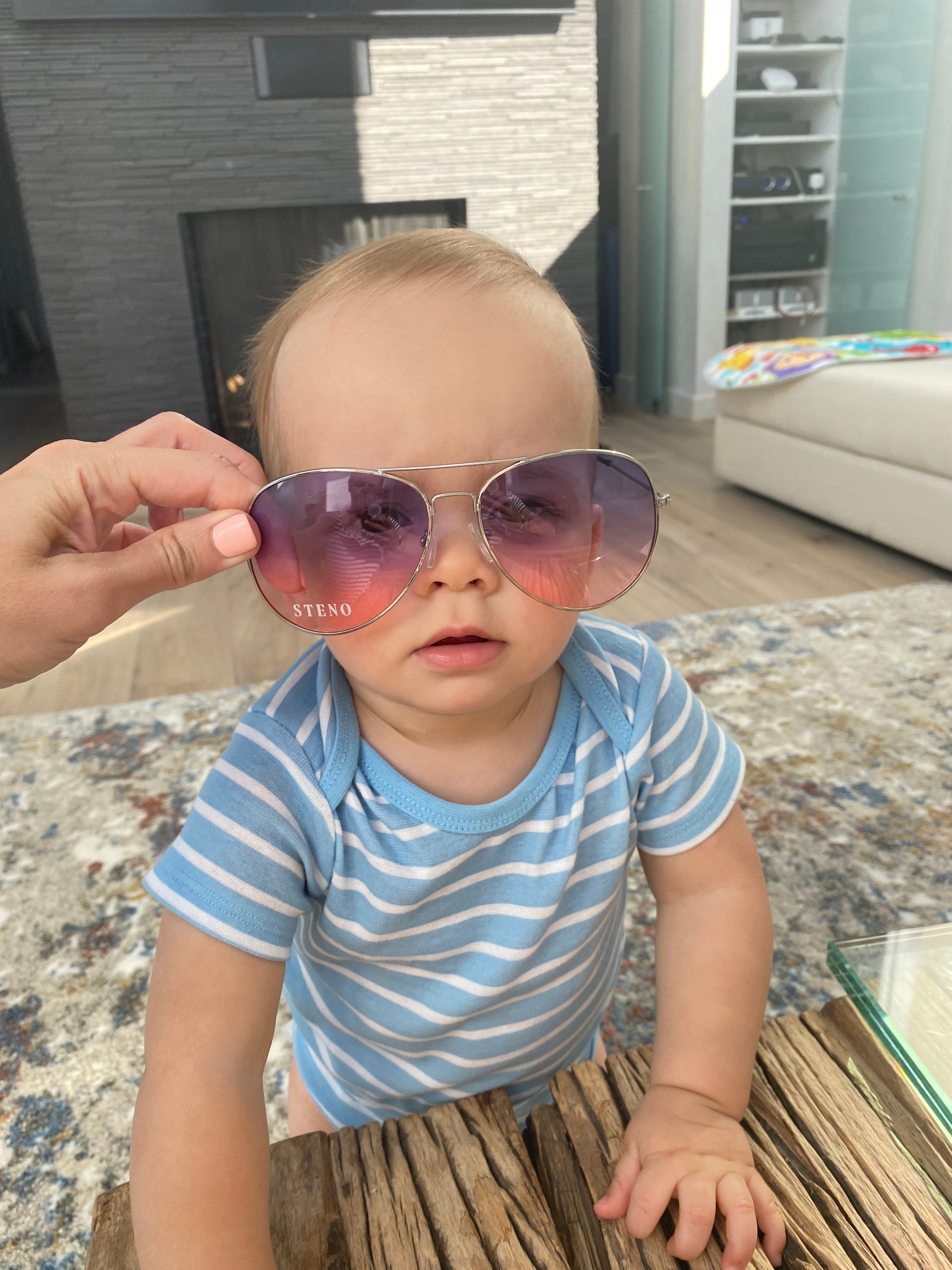 A photo of Carmela's son, Luke, wearing a pair of Steno aviators