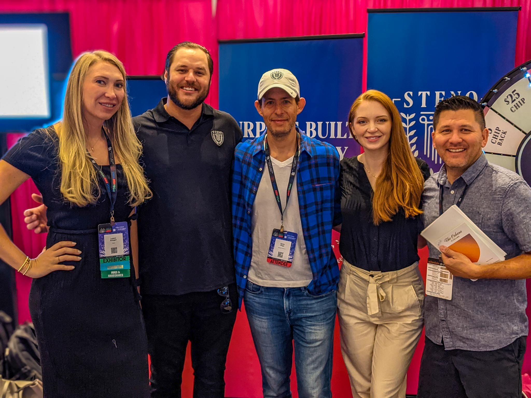 Five Steno employees pose in the exhibit hall at Steno's booth